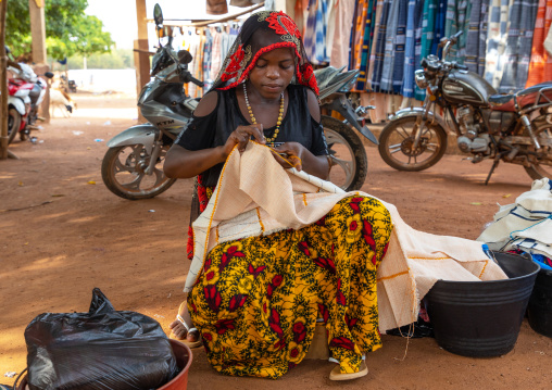 Senufo woman sewing in a market, Savanes district, Waraniene, Ivory Coast