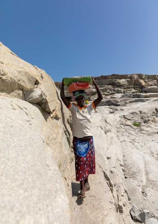 African women carrying stones in a granite quarry, Savanes district, Shienlow, Ivory Coast