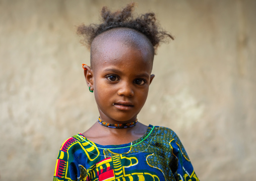 Portrait of a Peul tribe girl with a strange haircut, Savanes district, Boundiali, Ivory Coast