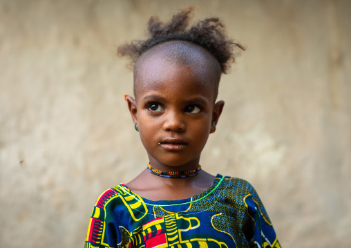 Portrait of a Peul tribe girl with a strange haircut, Savanes district, Boundiali, Ivory Coast