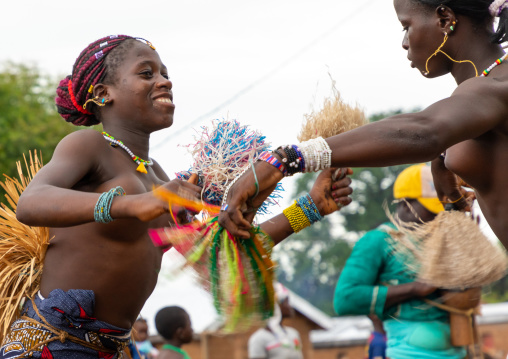 Young Senufo shirtless women dancing the Ngoro during a ceremony, Savanes district, Ndara, Ivory Coast