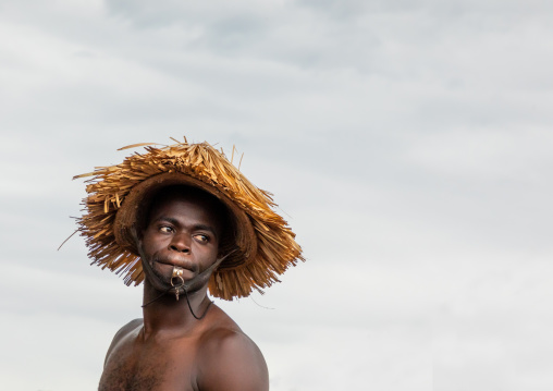 Senufo shirtless man dancing the Ngoro during a ceremony, Savanes district, Ndara, Ivory Coast