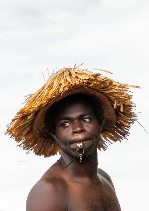 Senufo shirtless man dancing the Ngoro during a ceremony, Savanes district, Ndara, Ivory Coast