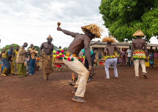 Senufo shirtless man dancing the Ngoro during a ceremony, Savanes district, Ndara, Ivory Coast