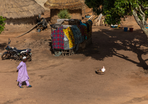 African muslim man walking in a village, Denguélé, Korondougou, Ivory Coast