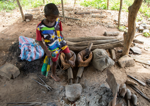 Child in a blacksmith workshop, Bafing, Yo, Ivory Coast