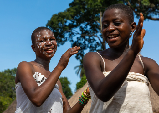 Dan tribe young women clapping hands and dancing during a ceremony, Bafing, Gboni, Ivory Coast