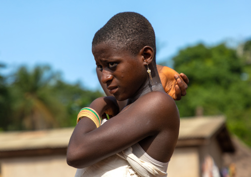 Dan tribe young woman dancing during a ceremony, Bafing, Gboni, Ivory Coast