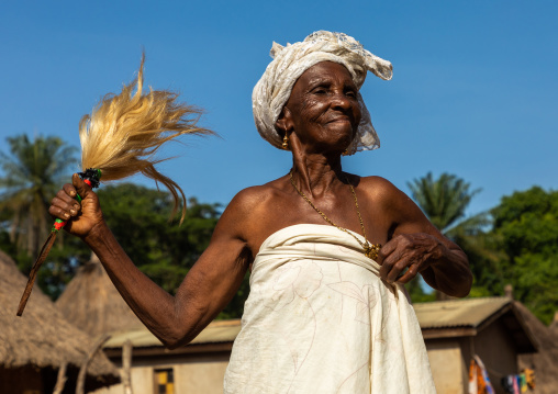 Dan tribe senior woman dancing during a ceremony, Bafing, Gboni, Ivory Coast