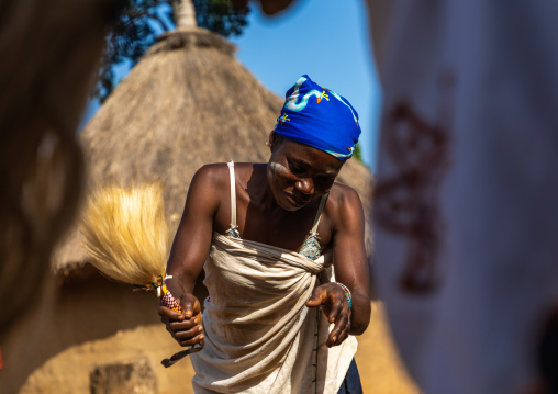 Dan tribe woman dancing with a fly-whisk during a ceremony, Bafing, Gboni, Ivory Coast