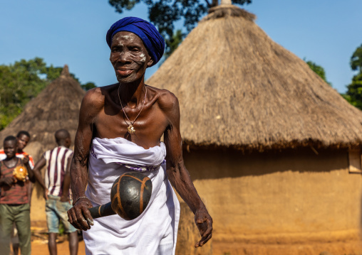 Dan tribe senior woman dancing during a ceremony, Bafing, Gboni, Ivory Coast