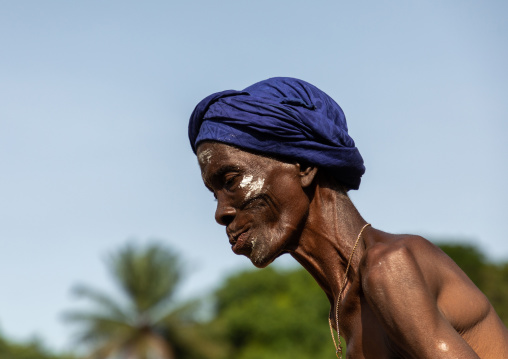 Dan tribe senior woman dancing during a ceremony, Bafing, Gboni, Ivory Coast