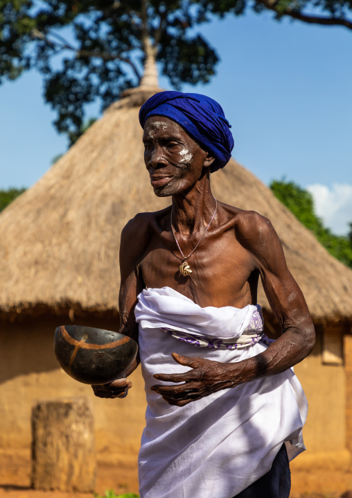 Dan tribe senior woman dancing during a ceremony, Bafing, Gboni, Ivory Coast