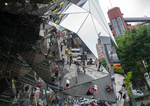 Walking people reflected on glass in tokyu plaza i, Kanto region, Tokyo, Japan