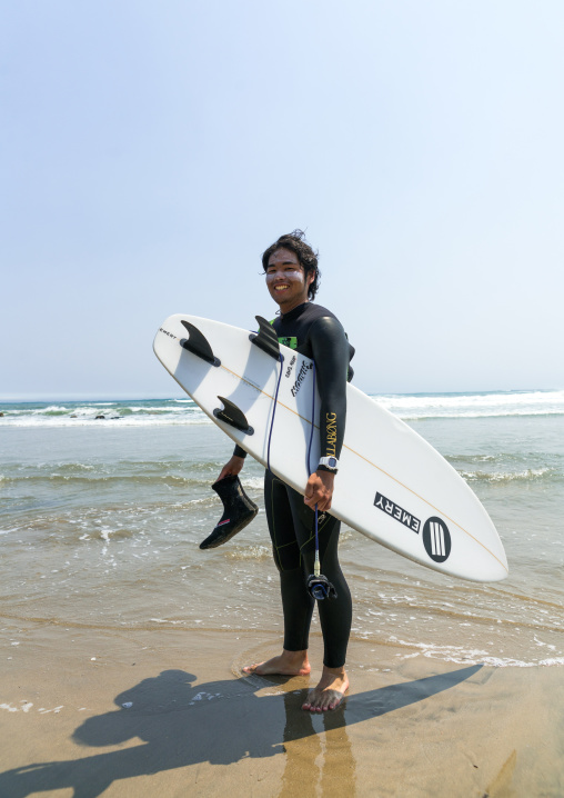 Japanese surfer in the contaminated area after the daiichi nuclear power plant irradiation, Fukushima prefecture, Tairatoyoma beach, Japan