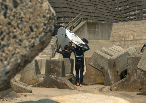 Japanese surfers in the contaminated area after the daiichi nuclear power plant irradiation, Fukushima prefecture, Tairatoyoma beach, Japan