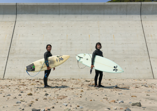 Japanese surfers in the contaminated area after the daiichi nuclear power plant irradiation, Fukushima prefecture, Tairatoyoma beach, Japan