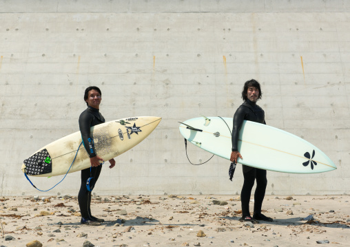 Japanese surfers in the contaminated area after the daiichi nuclear power plant irradiation, Fukushima prefecture, Tairatoyoma beach, Japan