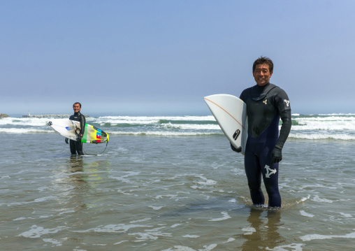 Japanese surfers in the contaminated area after the daiichi nuclear power plant irradiation, Fukushima prefecture, Tairatoyoma beach, Japan