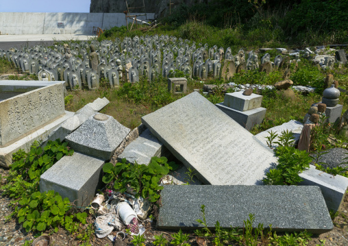 Stone baby statues called jizobosatsu protecting the souls of aborted children after the tsunami, Fukushima prefecture, Tairatoyoma beach, Japan