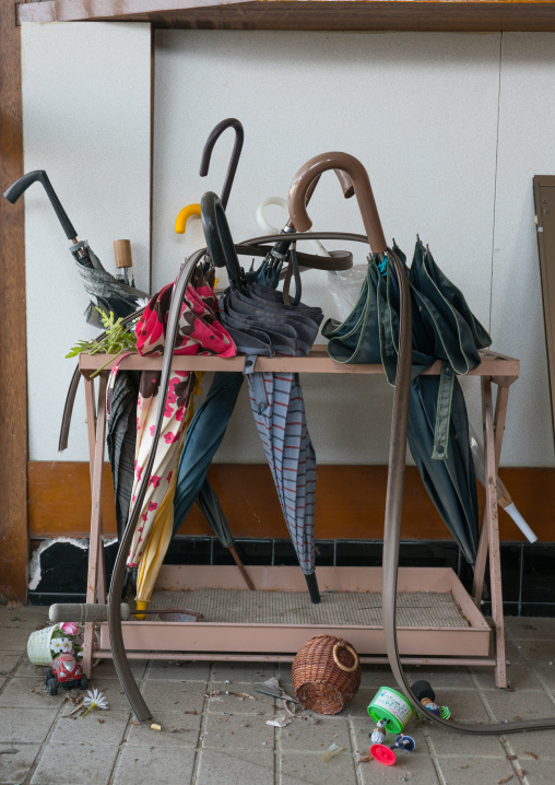 Umbrellas in an abandoned school in the difficult-to-return zone after the daiichi nuclear power plant irradiation, Fukushima prefecture, Tomioka, Japan