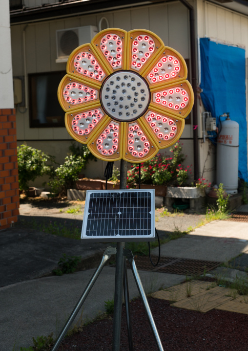 Traffic road with solar panel in the highly contaminated area after the daiichi nuclear power plant irradiation, Fukushima prefecture, Tomioka, Japan