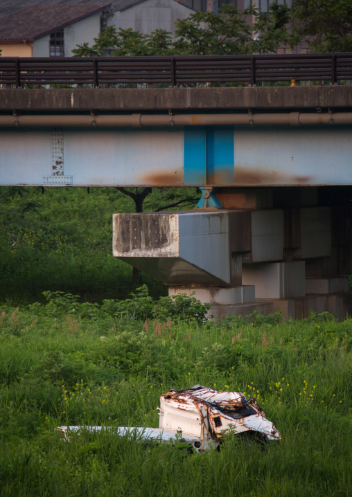 A destroyed and abandoned car by 2011 tsunami, Fukushima prefecture, Tomioka, Japan