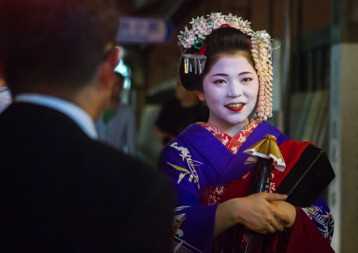 Geisha with businessmen in the streets of gion, Kansai region, Kyoto, Japan