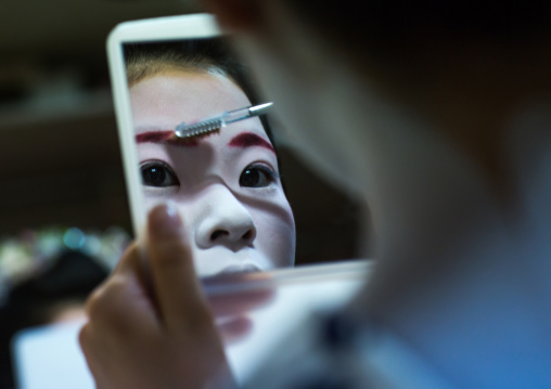 16 Years old maiko called chikasaya during a make up session, Kansai region, Kyoto, Japan