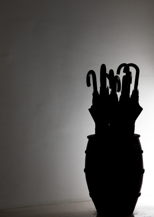 Closed umbrellas silhouette inside a house, Yaeyama Islands, Ishigaki, Japan