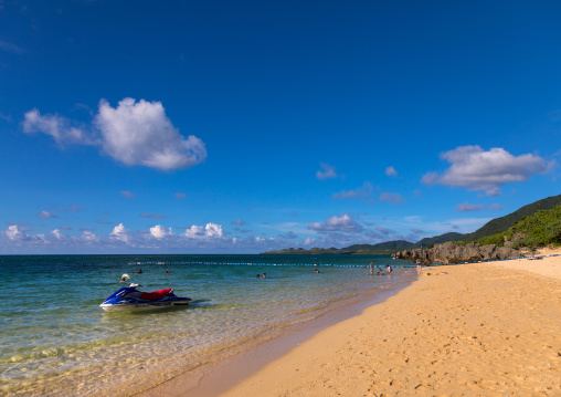 Tourists swimming in sunset beach, Yaeyama Islands, Ishigaki, Japan