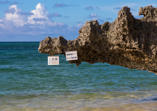 No swimming billboard in sunset beach, Yaeyama Islands, Ishigaki, Japan