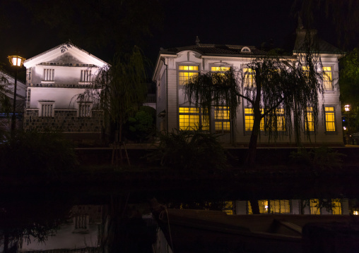 Old houses along the riverbank by night in Bikan historical quarter, Okayama Prefecture, Kurashiki, Japan