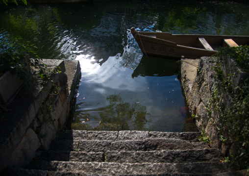 Boat moored at riverbank, Okayama Prefecture, Kurashiki, Japan