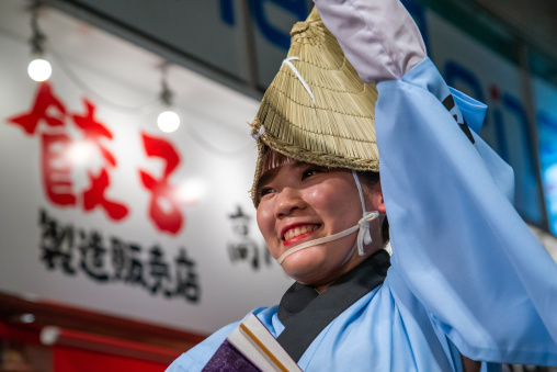 Japanese woman with straw hat during the Koenji Awaodori dance summer street festival, Kanto region, Tokyo, Japan