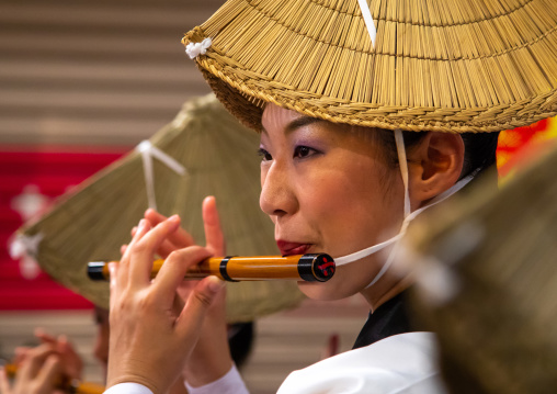 Japanese woman with straw hat during the Koenji Awaodori dance summer street festival, Kanto region, Tokyo, Japan