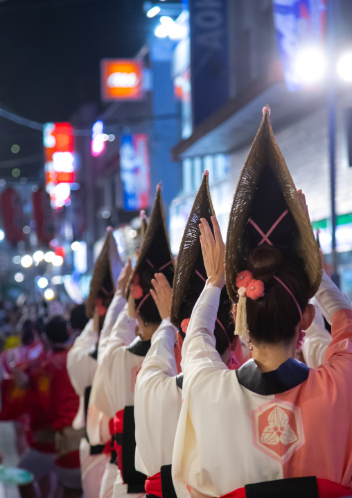 Rear view of japanese women with straw hats during the Koenji Awaodori dance summer street festival, Kanto region, Tokyo, Japan