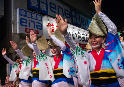 Japanese women with straw hats during the Koenji Awaodori dance summer street festival, Kanto region, Tokyo, Japan