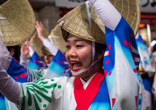 Japanese girl with straw hat during the Koenji Awaodori dance summer street festival, Kanto region, Tokyo, Japan