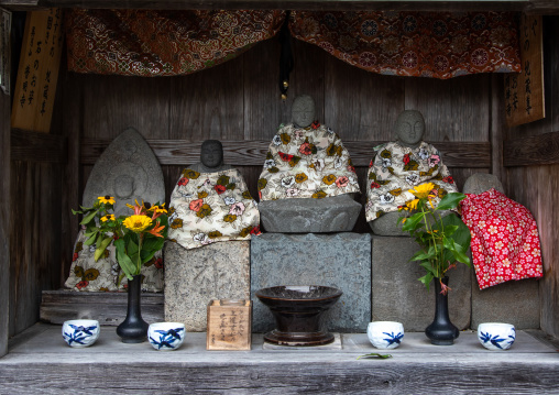 Stone statues in a shinto shrine, Kyoto Prefecture, Miyama, Japan