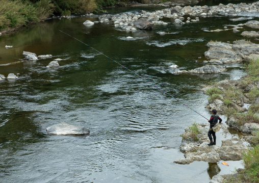 Japanese man fishing in a river, Kyoto Prefecture, Miyama, Japan