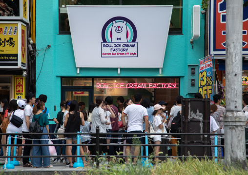 People queueing to buy ice creams in the street, Kansai region, Osaka, Japan