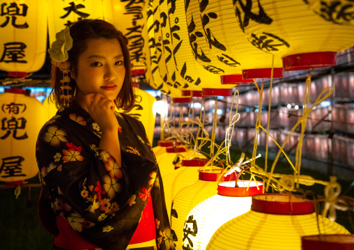 Japanese woman in yaukuta during Gokoku shrine Mitama matsuri Obon festival celebrating the return of the spirits of the deads, Kyushu region, Fukuoka, Japan