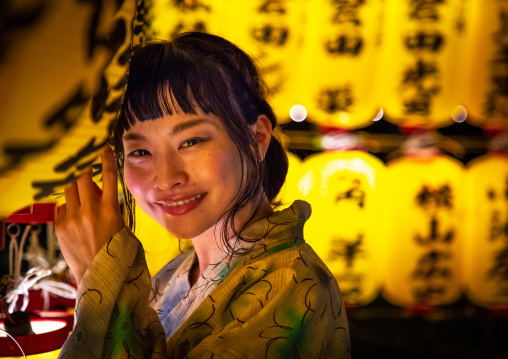 Japanese woman in yaukuta during Gokoku shrine Mitama matsuri Obon festival celebrating the return of the spirits of the deads, Kyushu region, Fukuoka, Japan