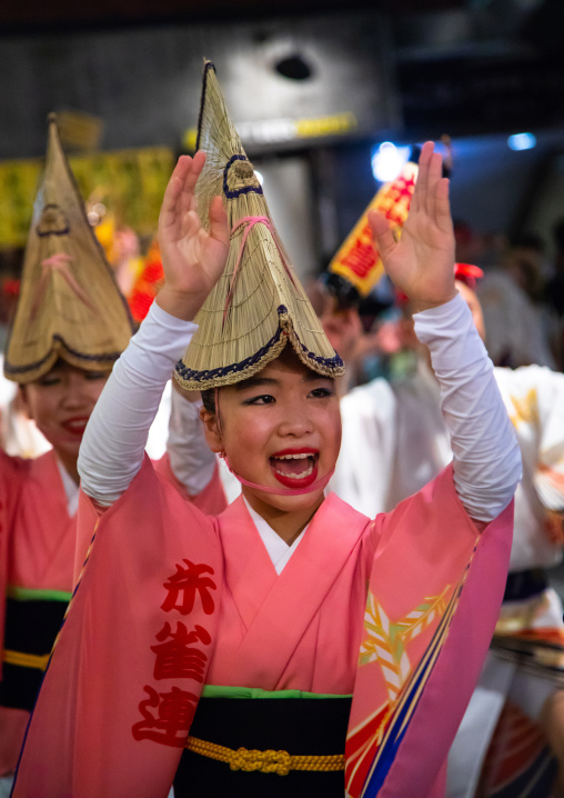 Japanese women with straw hats during the Koenji Awaodori dance summer street festival, Kanto region, Tokyo, Japan