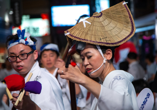 Japanese women with straw hats during the Koenji Awaodori dance summer street festival, Kanto region, Tokyo, Japan