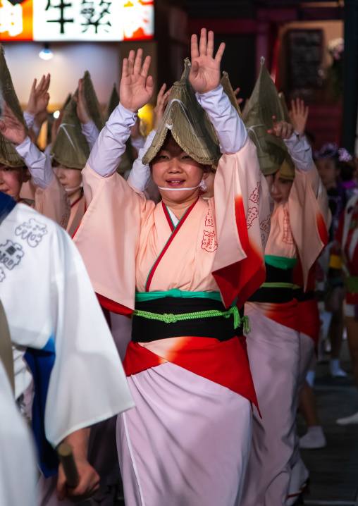 Japanese women with straw hats during the Koenji Awaodori dance summer street festival, Kanto region, Tokyo, Japan