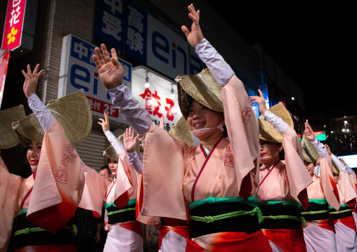 Japanese women with straw hats during the Koenji Awaodori dance summer street festival, Kanto region, Tokyo, Japan