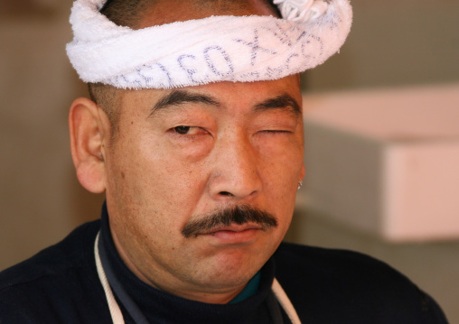 Vendor in Tsukiji fish market, Kanto region, Tokyo, Japan