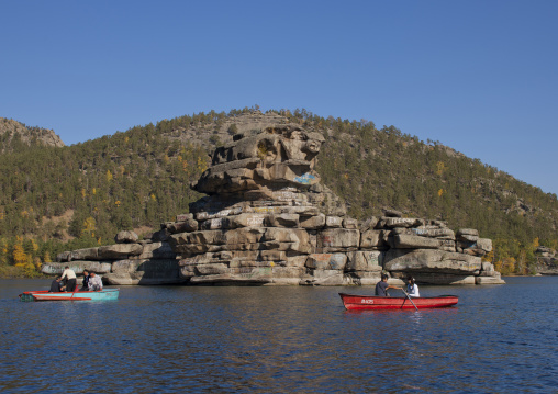 Tourists With Small Boats Around The Lady Rock In Burabay Lake, Kazakhstan